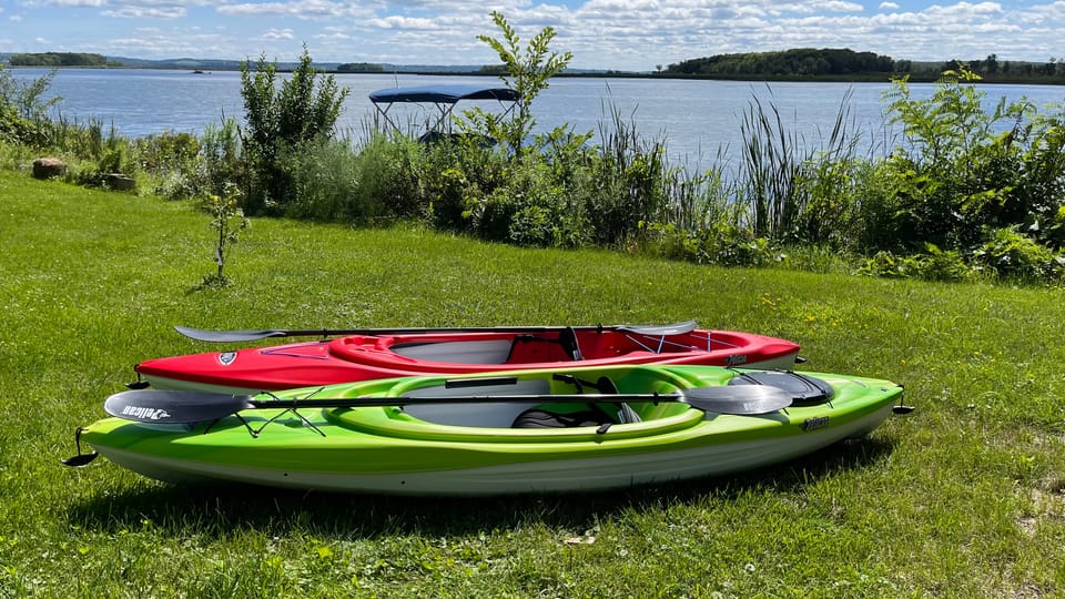 Two kayaks ready by the water